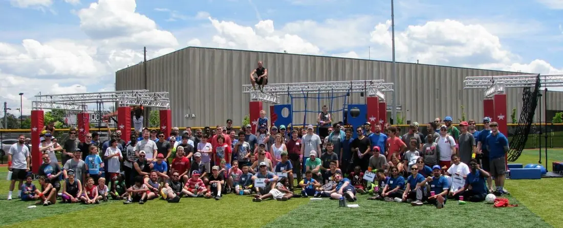 Large group of participants at a major obstacle course event