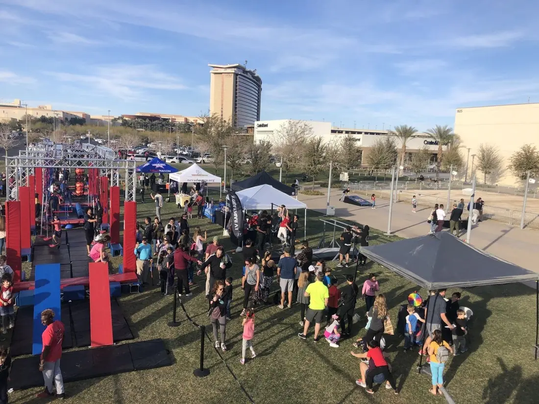 Kids lining up to run an outdoor mobile obstacle course